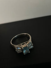 Pale Blue Emerald-Cut Three-Stone Ring